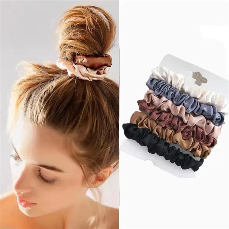 Satin scrunchies in assorted colors with a low bun hairstyle